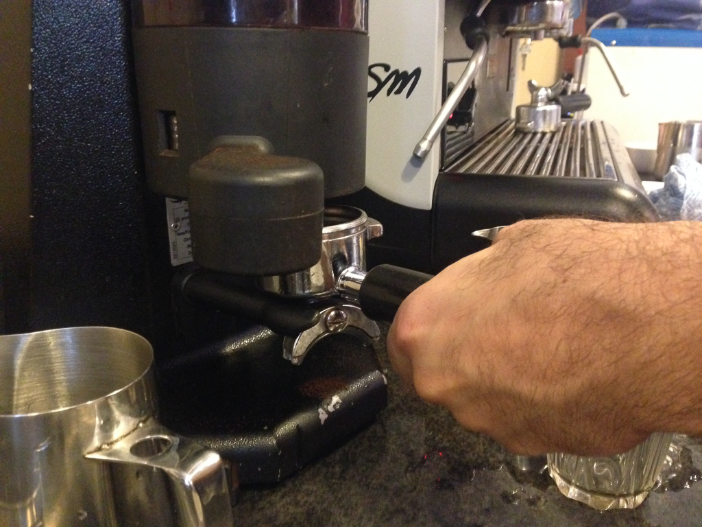 A slide of the grinder's lever drops in the right amount of coffee per serving.
